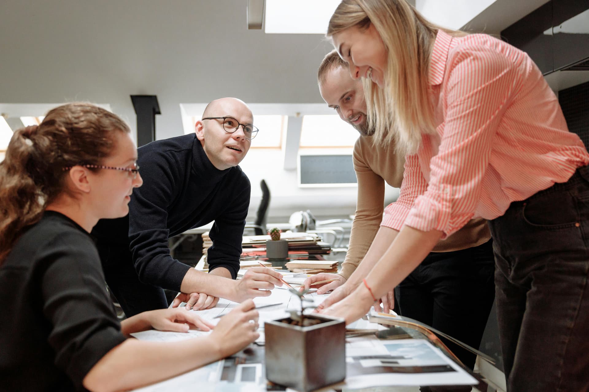 People discussing work in a modern studio