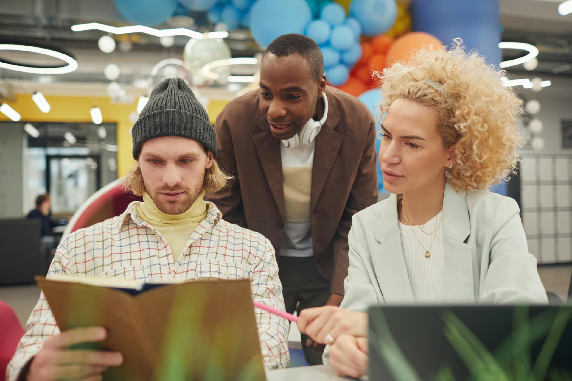 A small team collaborating around a desk
